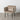 Beigefarbener Sessel mit schwarzen Metallbeinen (76 x 64 x 77)